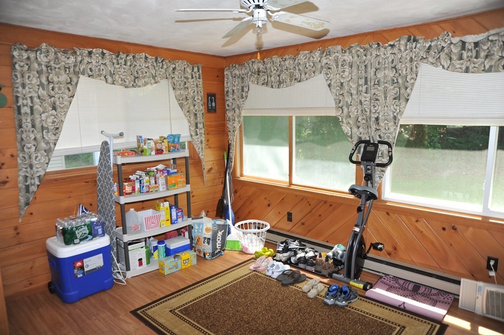 37 Raechel Road, Unit 37 Randolph, MA 02368 - Photo 8 of 15 a room with lots of books and a large mirror