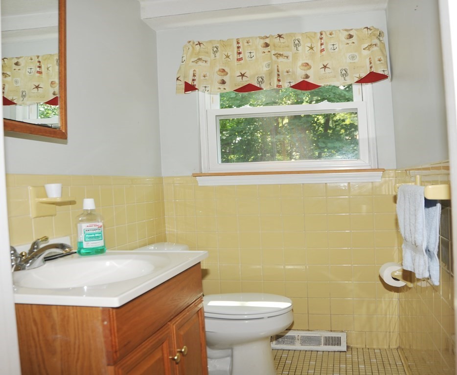 37 Raechel Road, Unit 37 Randolph, MA 02368 - Photo 10 of 15 a bathroom with a sink toilet and mirror