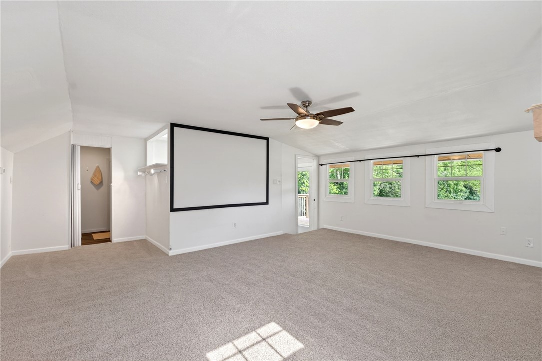 2684 Arthur Road Springfield, OH 45502 - Photo 33 of 69 This bright, spacious room offers a large screen for entertainment and views of the surrounding greenery.