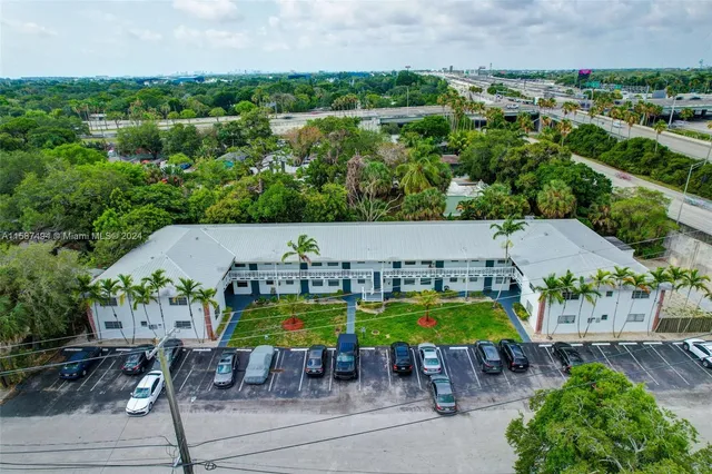 an aerial view of a house with swimming pool patio and outdoor seating