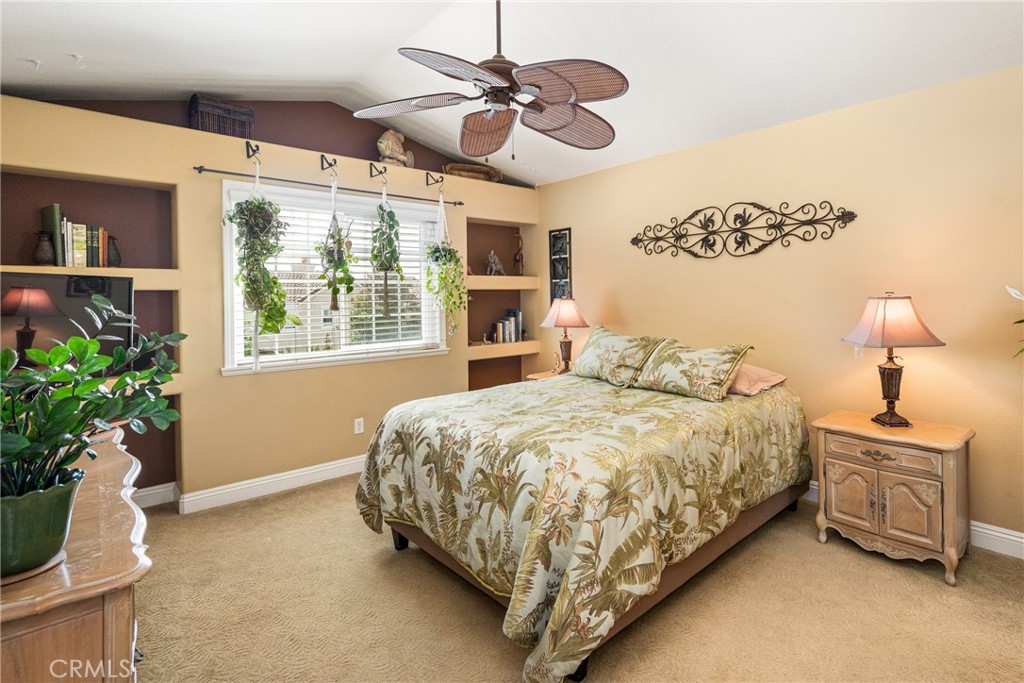 2370 Tryall Tustin, CA 92782 - Photo 18 of 36 a bedroom with a bed dresser and a window