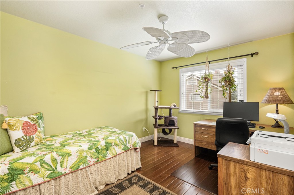 2370 Tryall Tustin, CA 92782 - Photo 22 of 36 a bedroom with a bed and wooden floor