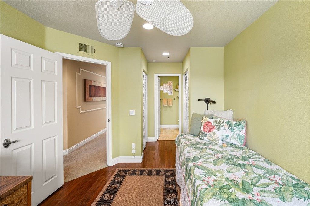 2370 Tryall Tustin, CA 92782 - Photo 23 of 36 a bedroom with a bed and wooden floor