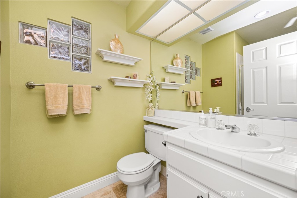 2370 Tryall Tustin, CA 92782 - Photo 24 of 36 a bathroom with a sink and a mirror