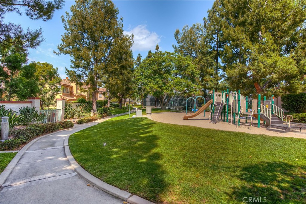 2370 Tryall Tustin, CA 92782 - Photo 31 of 36 a view of a swimming pool with a garden