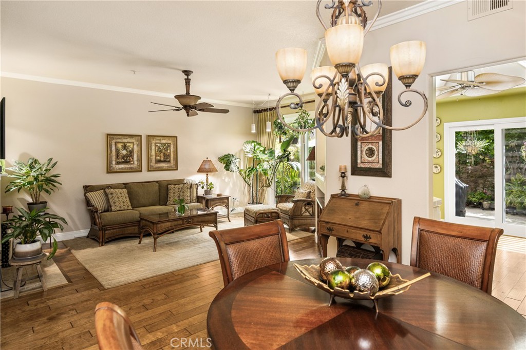 2370 Tryall Tustin, CA 92782 - Photo 4 of 36 a living room with furniture kitchen view and a chandelier