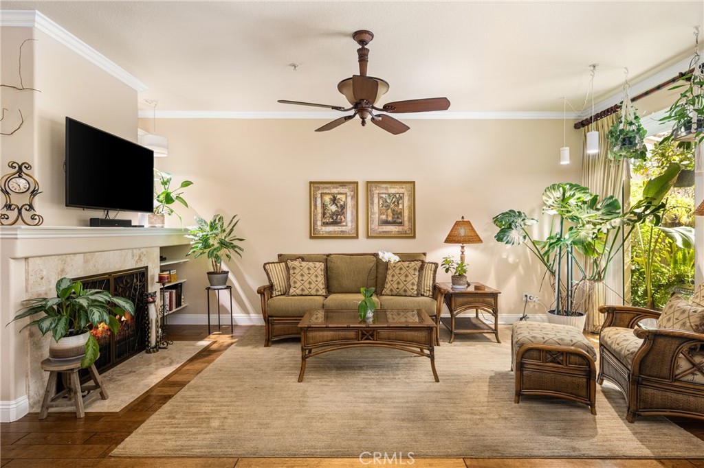 2370 Tryall Tustin, CA 92782 - Photo 5 of 36 a living room with furniture a fireplace and a flat screen tv