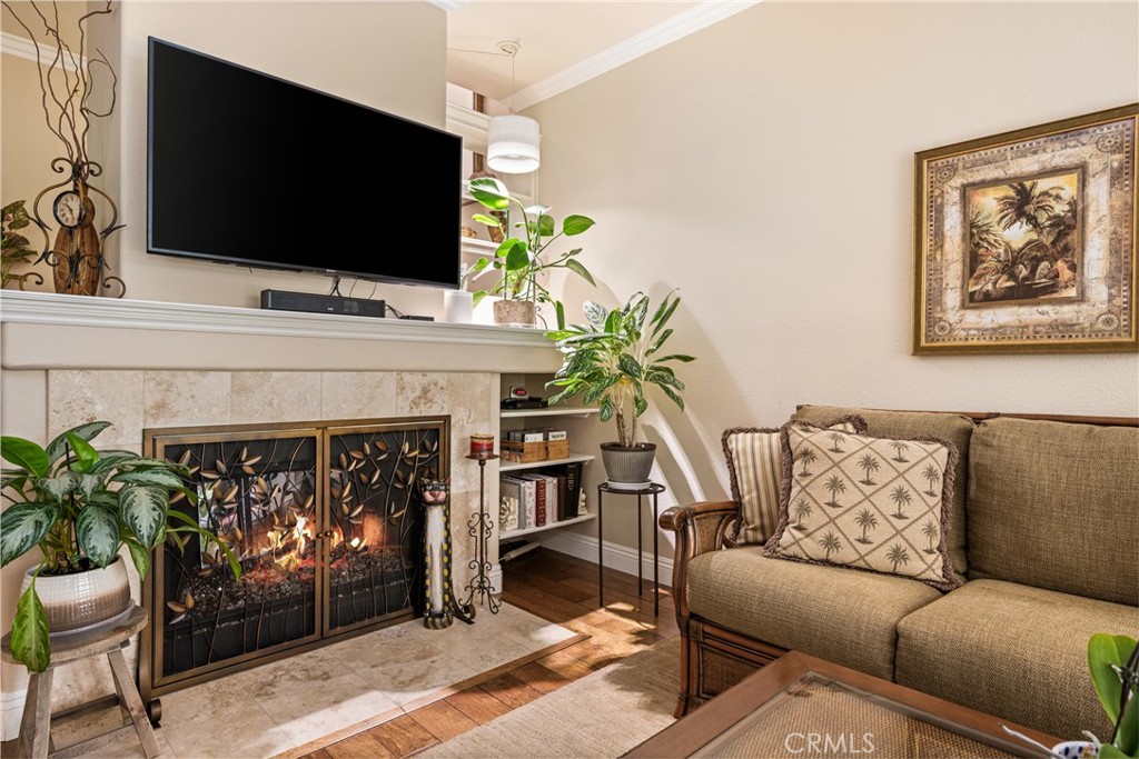 2370 Tryall Tustin, CA 92782 - Photo 6 of 36 a living room with furniture a fireplace and a flat screen tv