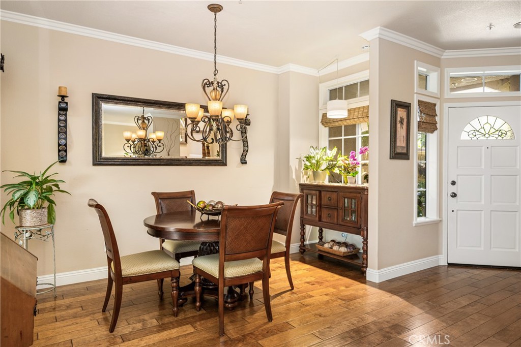 2370 Tryall Tustin, CA 92782 - Photo 7 of 36 a view of a dining room with furniture and chandelier