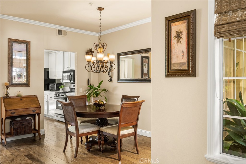 2370 Tryall Tustin, CA 92782 - Photo 8 of 36 a view of a dining room with furniture and chandelier