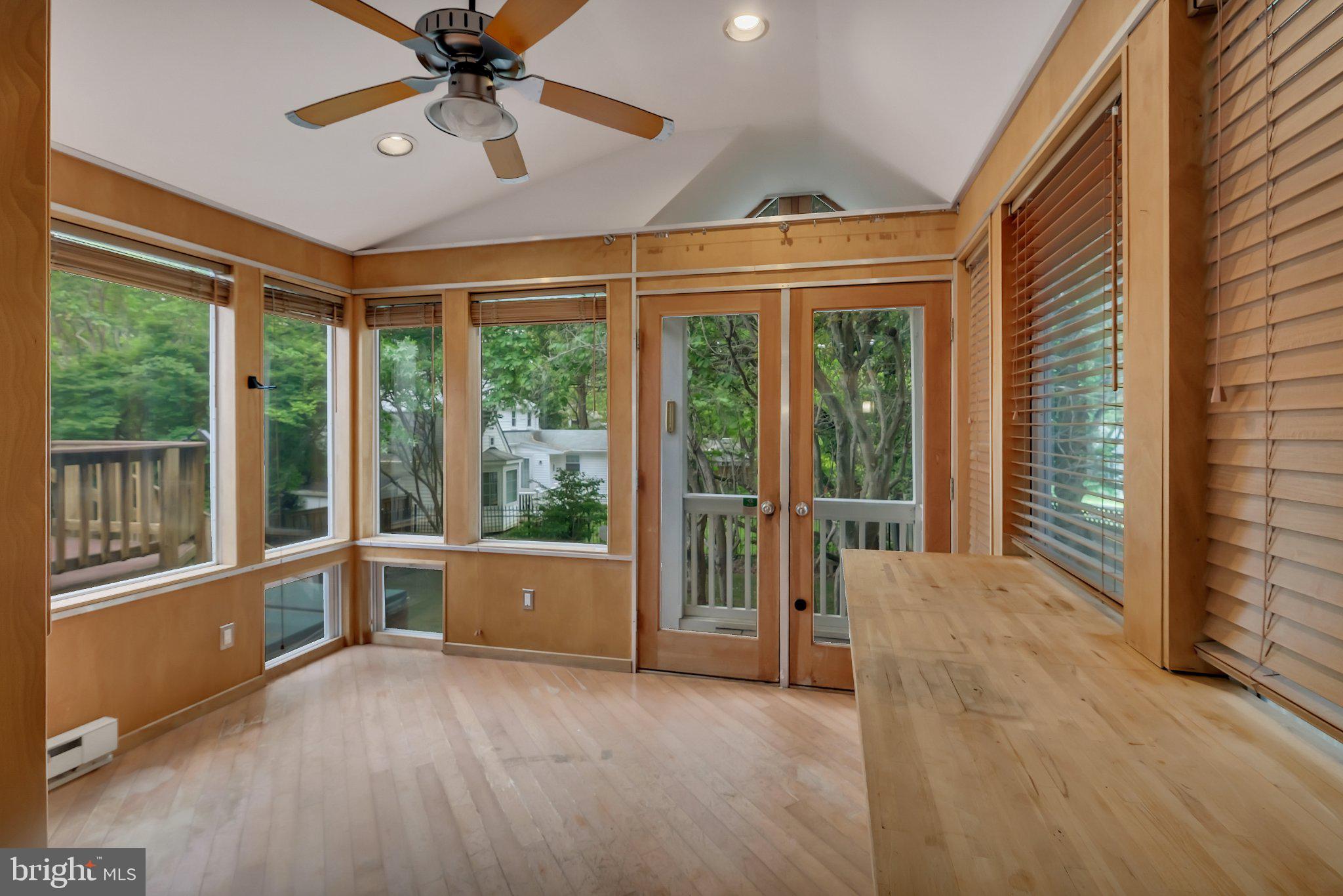 1706 North Glebe Road Arlington, VA 22207 - Photo 15 of 36 Bright sunroom with nature views.