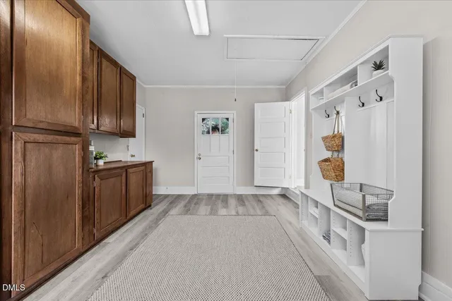 a kitchen with granite countertop a refrigerator and wooden cabinets