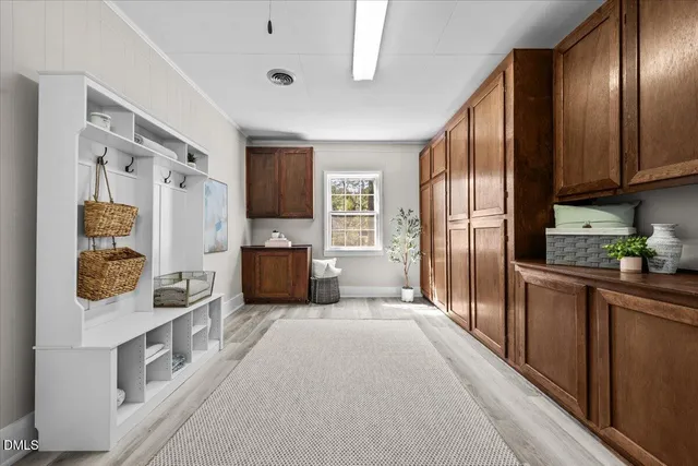 a large kitchen with a large window and stainless steel appliances