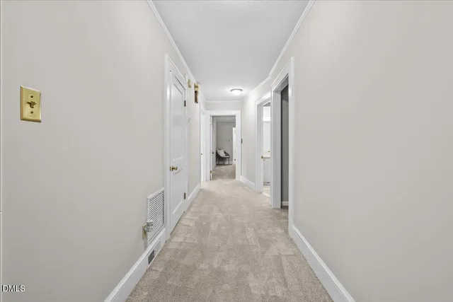 a bedroom with a bed and a chair