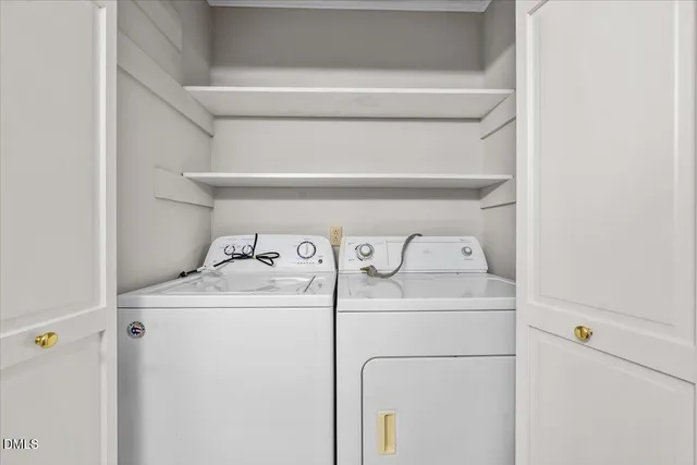 a view of a hallway with wooden floor and closet area