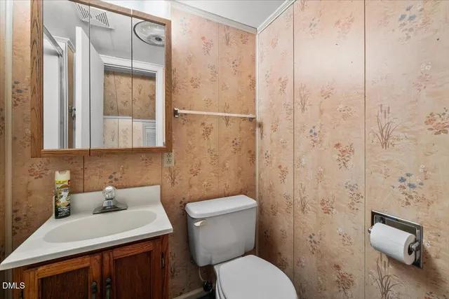 a view of a livingroom with a ceiling fan and window