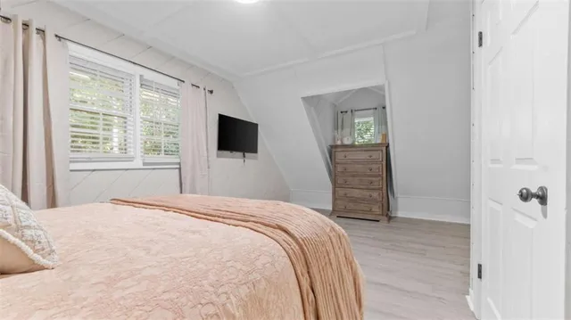 a bedroom with a bed and a dresser