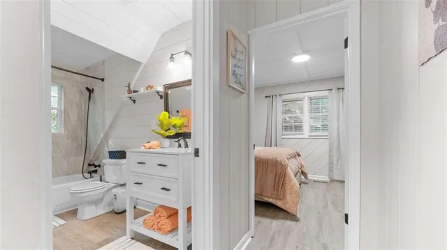 a view of living room with furniture and wooden floor