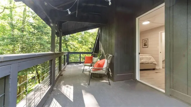 a balcony with furniture and a swing