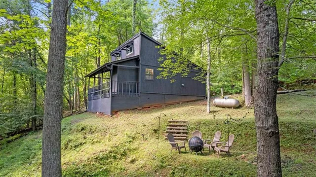 a view of house with backyard