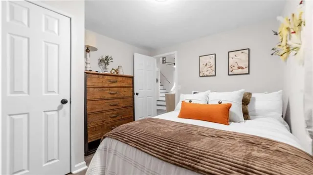 a bedroom with a bed and a cabinets