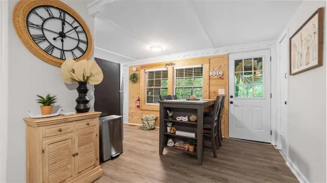 a view of a dining room with furniture window and outside view
