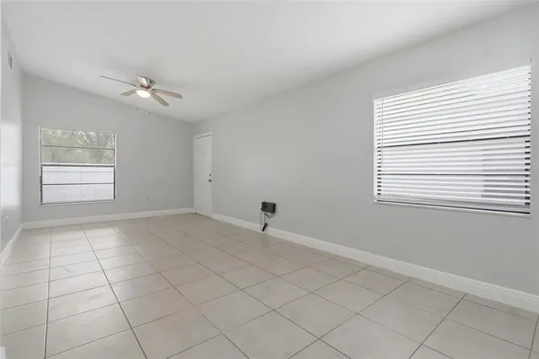 a view of an empty room with a window