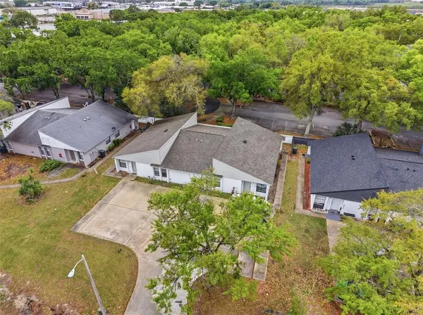an aerial view of a house with a garden