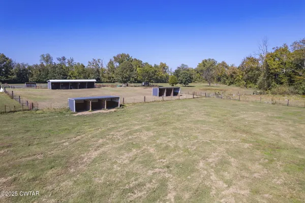 a backyard of a house with trees