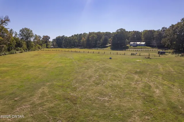 a balcony with table and chairs