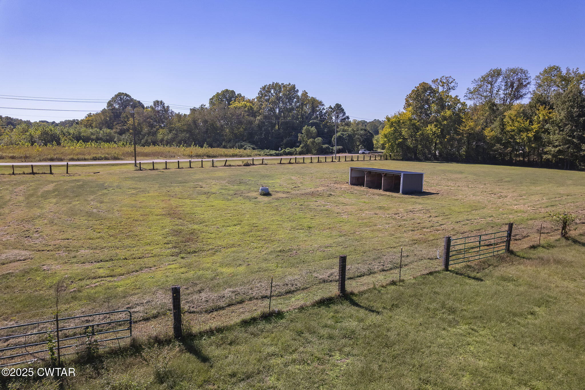 130 Cooper Anderson Road Jackson, TN 38305 - Photo 36 of 46 a view of a lake with a yard and mountain view