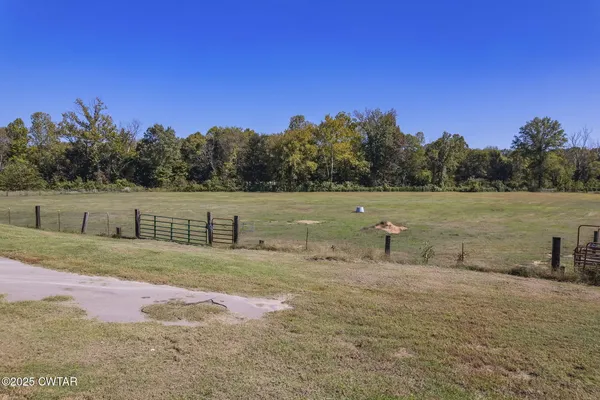 a view of swimming pool with a back yard