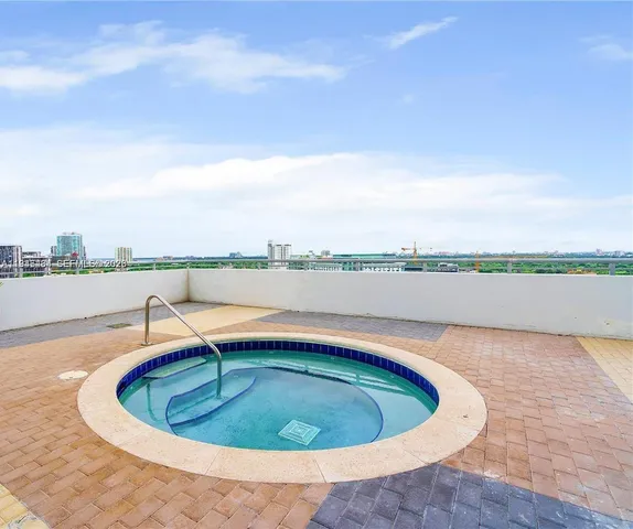 a view of a swimming pool with a lake view