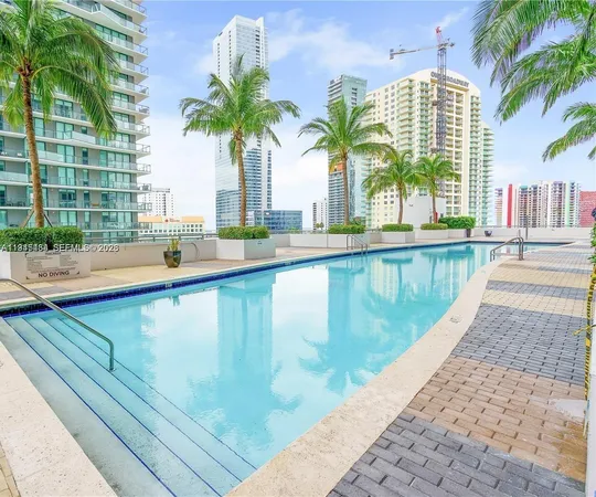 a view of swimming pool with outdoor seating
