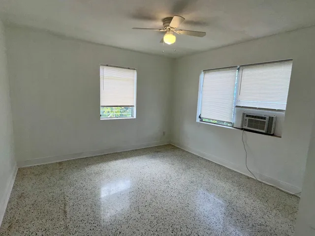 a view of a kitchen with a large window