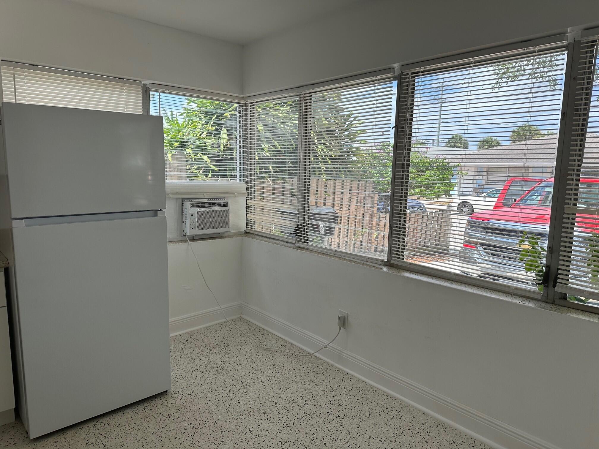 1426 North J Street, Unit 1 Lake Worth Beach, FL 33460 - Photo 4 of 9 a view of a kitchen with a large window