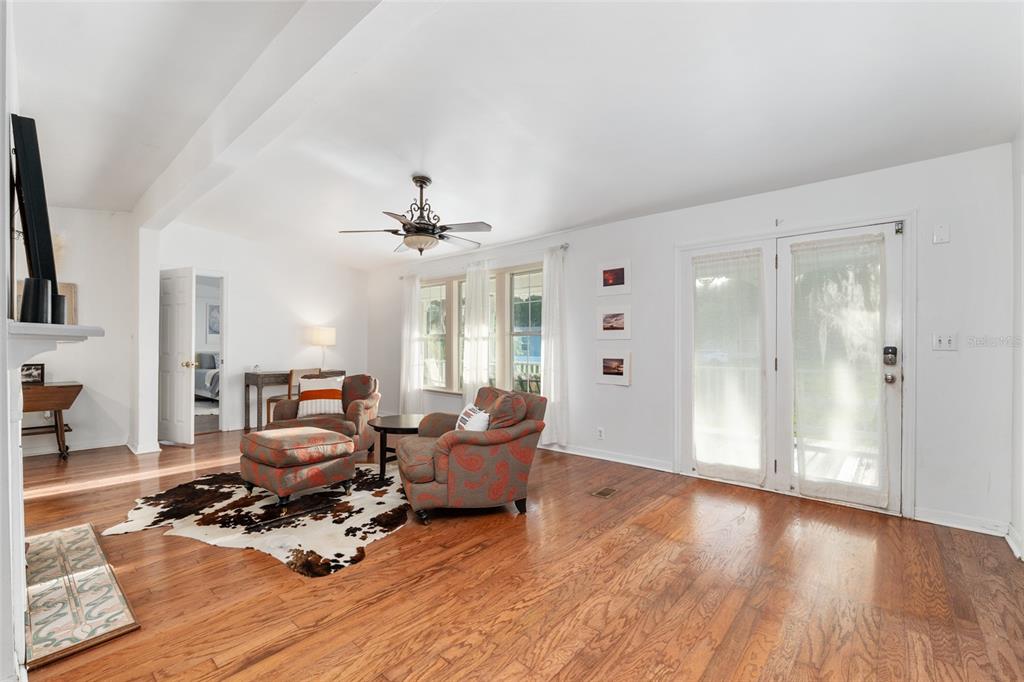 20361 1st Street McIntosh, FL 32664 - Photo 12 of 62 a living room with furniture window and wooden floor
