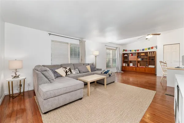 a dining room with furniture and window