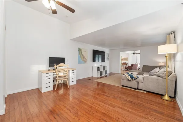 a kitchen with white cabinets and appliances