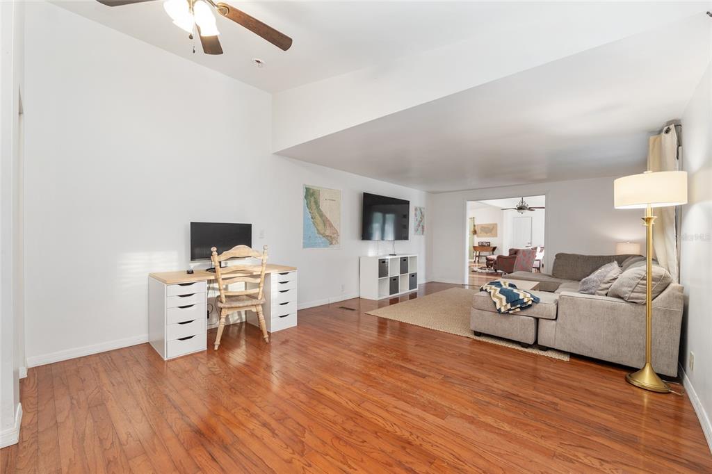 20361 1st Street McIntosh, FL 32664 - Photo 20 of 62 a living room with furniture and a flat screen tv