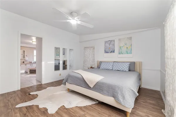 a bedroom with a large bed and a closet