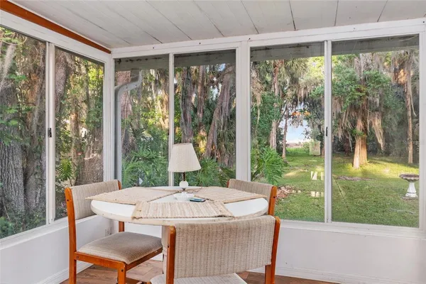 a view of a house with a yard and sitting area