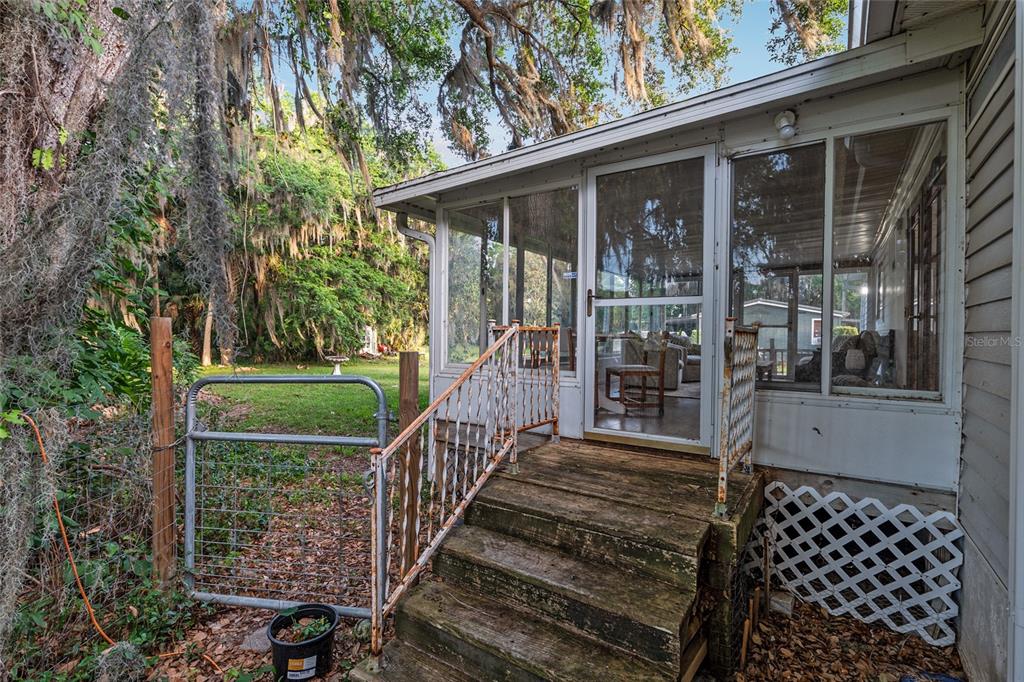 20361 1st Street McIntosh, FL 32664 - Photo 49 of 62 a view of a balcony with a swing