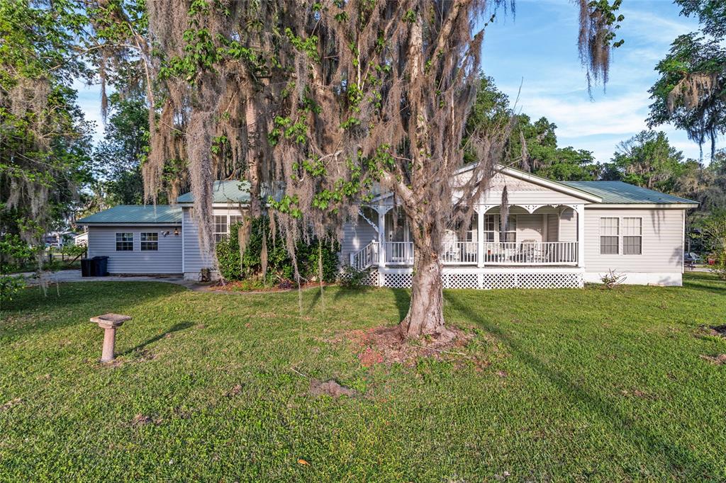 20361 1st Street McIntosh, FL 32664 - Photo 5 of 62 a view of a house with a yard and sitting area