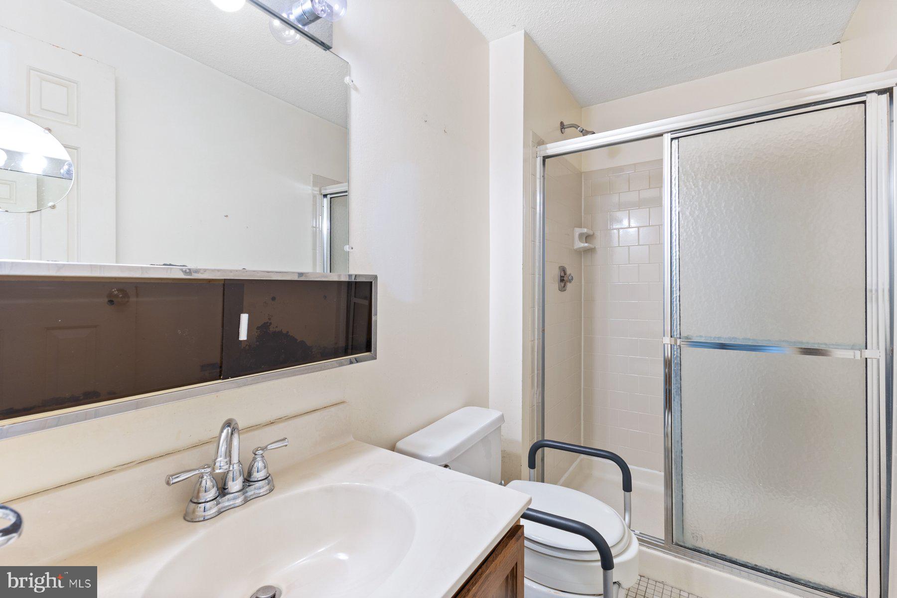 11337 Baroque Road Silver Spring, MD 20901 - Photo 15 of 29 a bathroom with a sink and a mirror