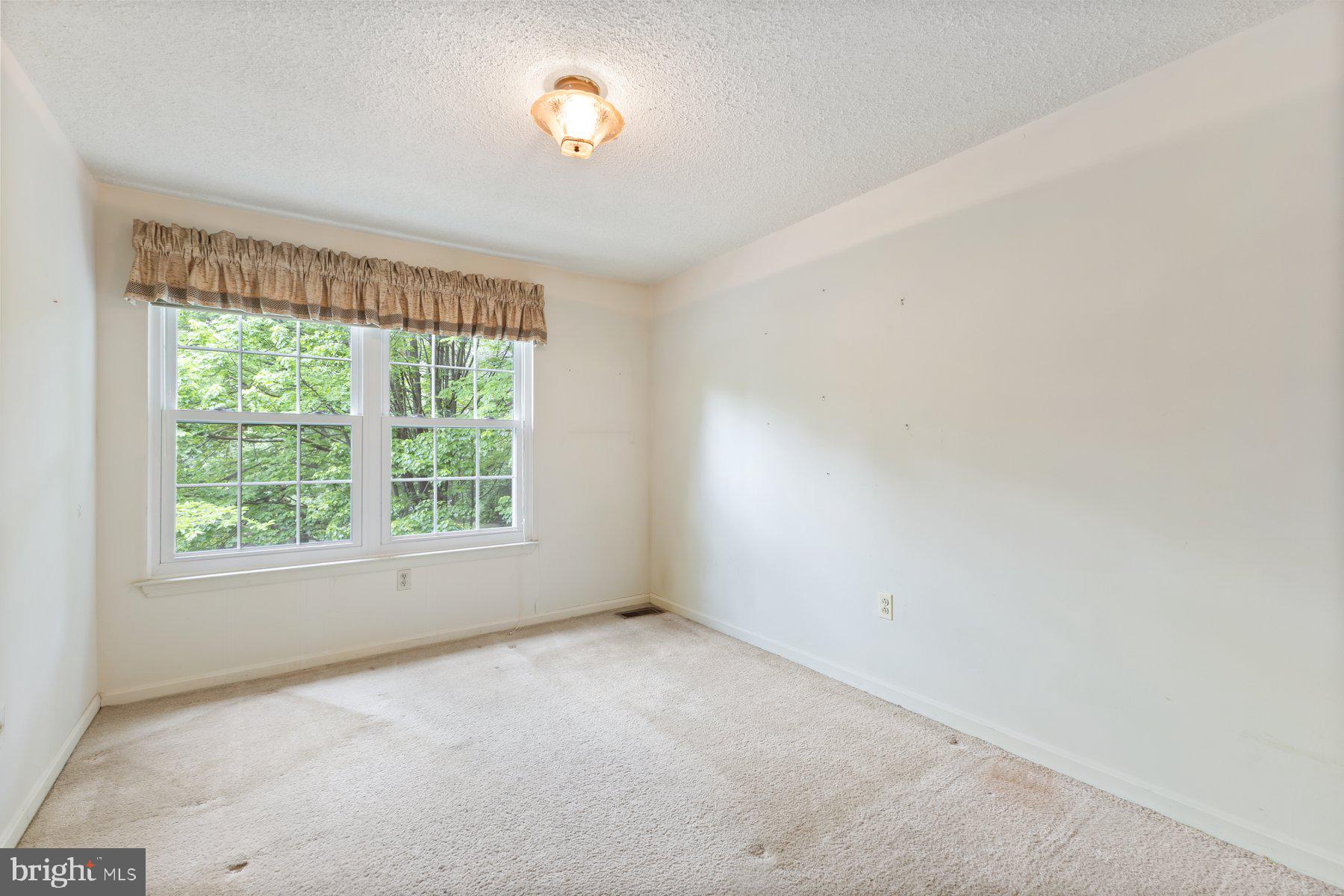 11337 Baroque Road Silver Spring, MD 20901 - Photo 16 of 29 an empty room with a window