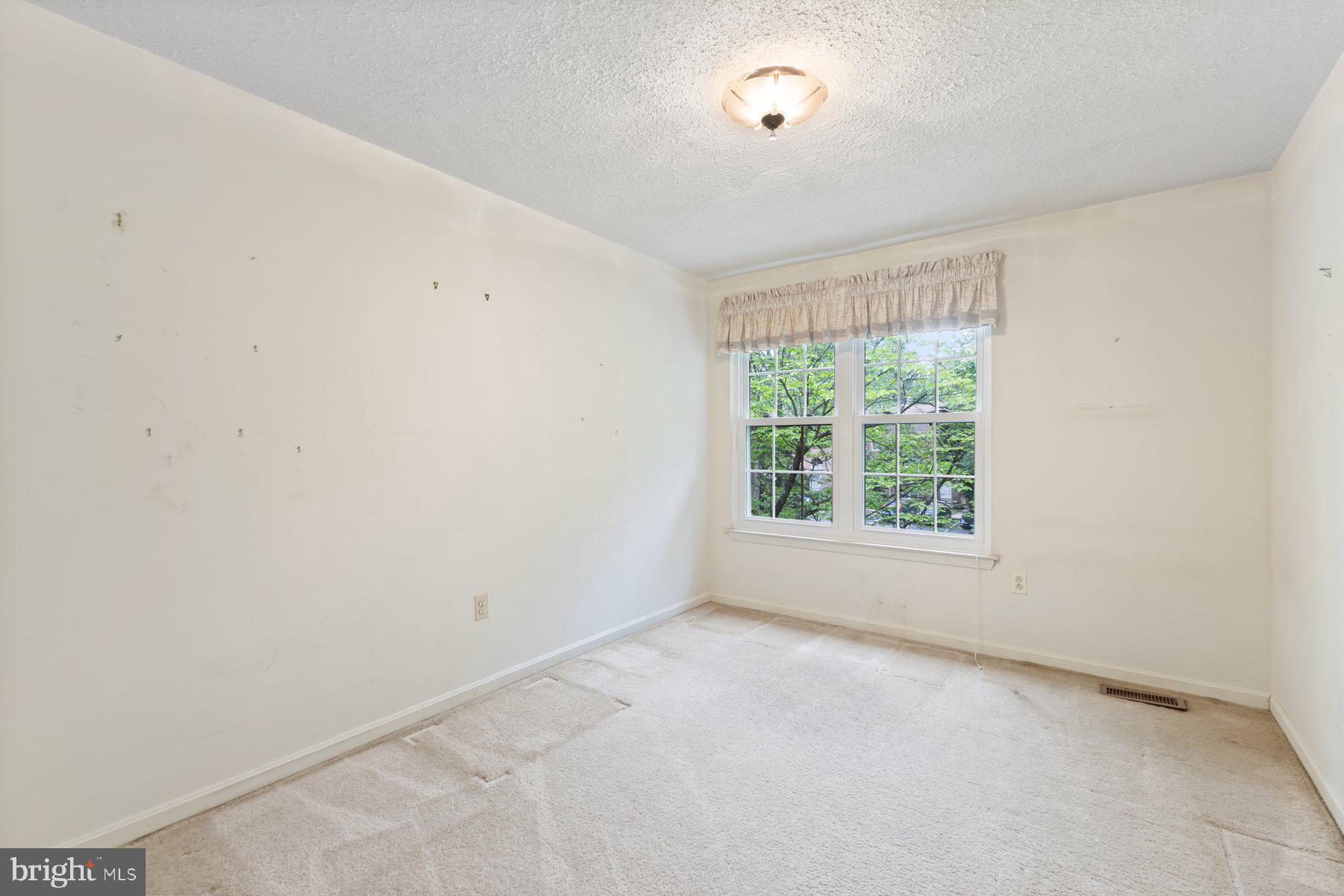 11337 Baroque Road Silver Spring, MD 20901 - Photo 18 of 29 an empty room with a window