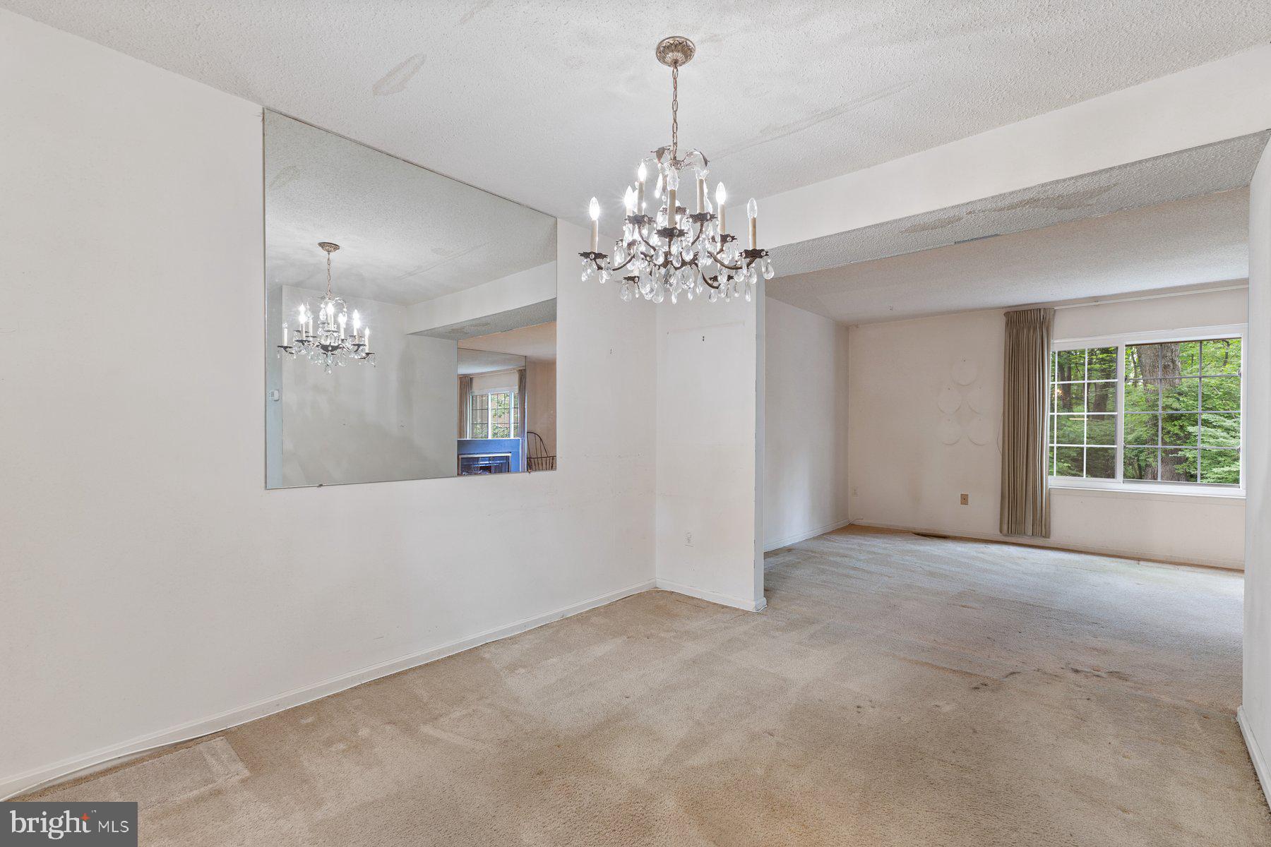 11337 Baroque Road Silver Spring, MD 20901 - Photo 6 of 29 a view of a big room with windows and chandelier