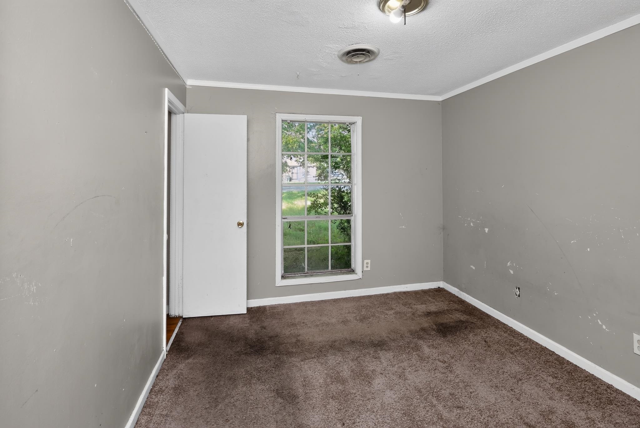 3791 Windermere Road Memphis, TN 38128 - Photo 12 of 18 Room with a window and a white door