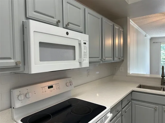 a view of an empty room with closet area